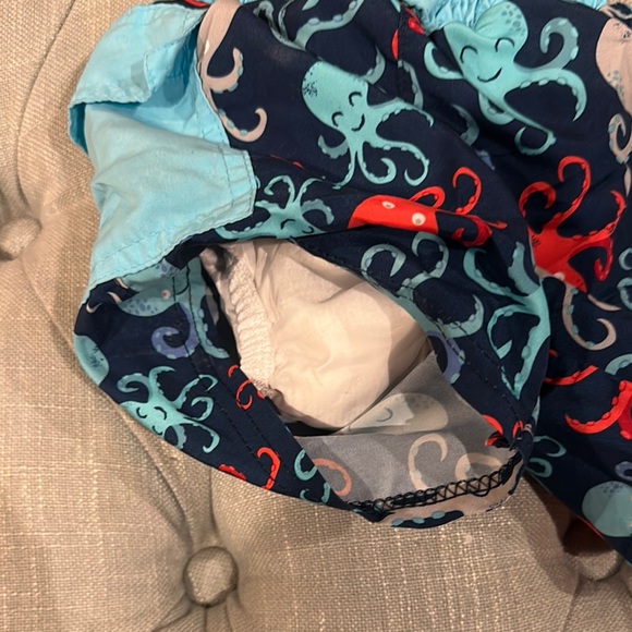 i play. Blue and Red Swim Trunks with Ocean-Themed Design - Picture 2 of 5